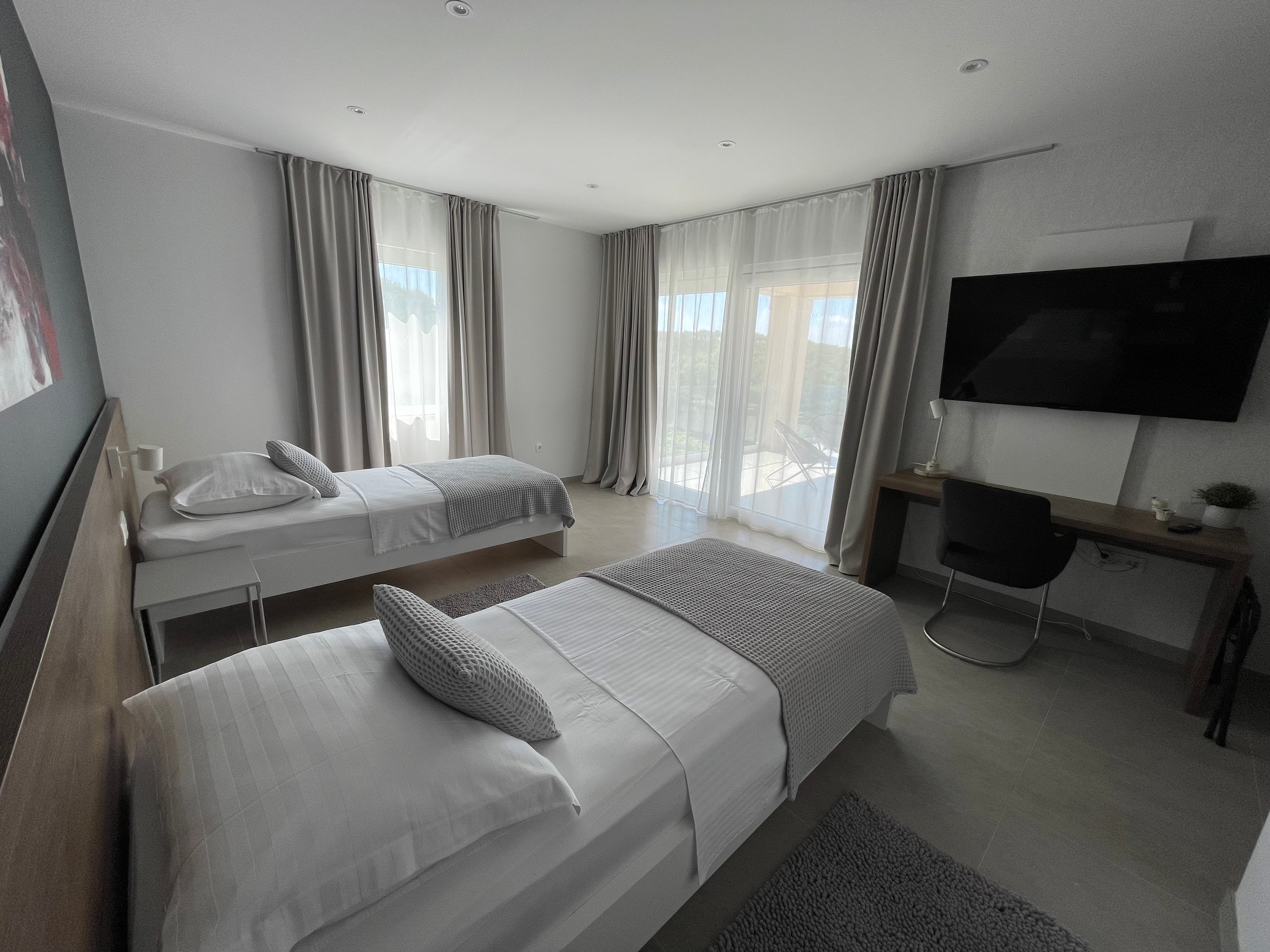Twin bedroom with balcony access